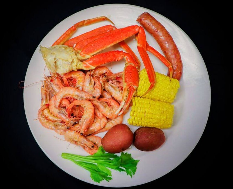 Boiled shrimp and snow crab with corn and potatoes